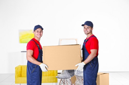 Man and van booking documents beside a moving van