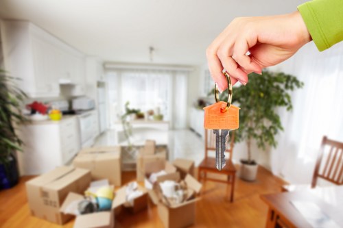 Removal team planning a move in West Hampstead street with residential flats