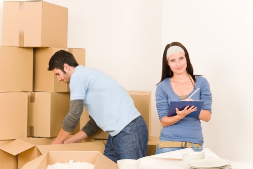 Packed moving boxes and furniture ready for transport