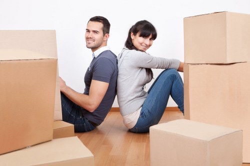 Professional movers handling furniture in a flat move