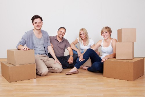 Packed moving boxes and furniture ready for a local house removal in West Hampstead