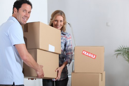 Loading wrapped furniture into a van with careful manual handling