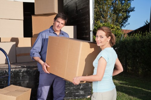 Packed moving boxes and furniture ready for transport in West Hampstead